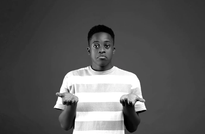 a boy with his arms crossed